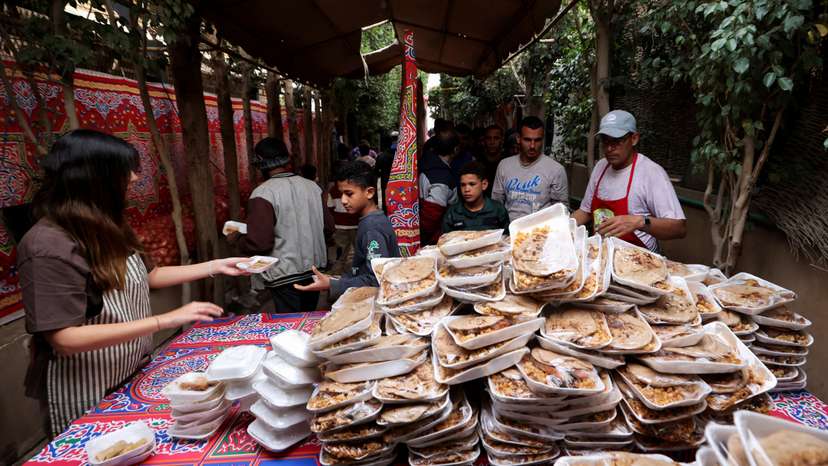 Hot meals are distributed during the holy month of Ramadan amid the economic crisis, in Cairo
