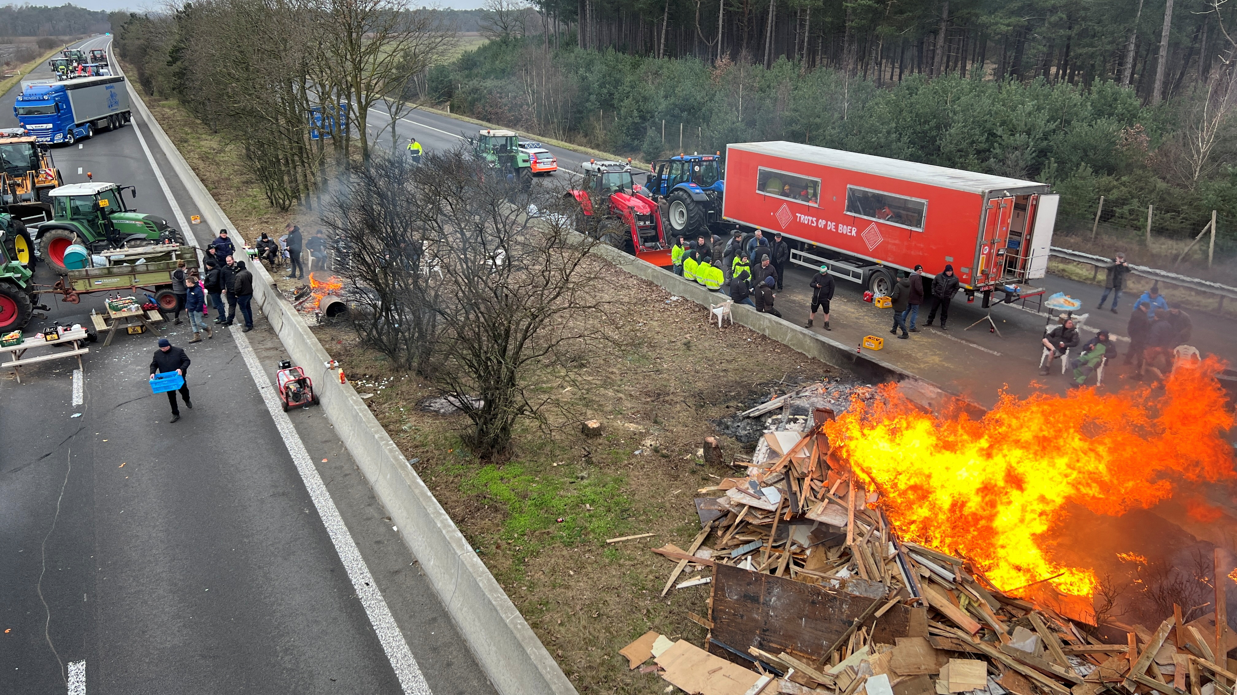 Farmers use their tractors to block a highway near the border with the Netherlands in Arendonk