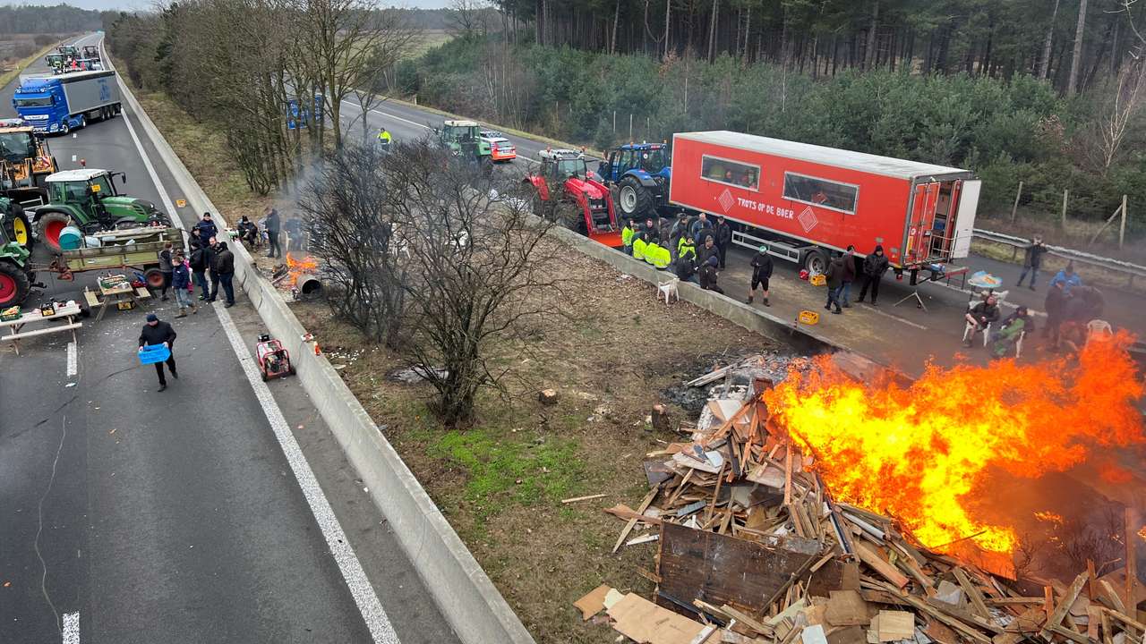 Farmers use their tractors to block a highway near the border with the Netherlands in Arendonk