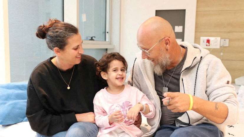 FILE PHOTO: Avigail Idan, who was released after being taken hostage during the October 7 attack by Palestinian militant group Hamas talks with her aunt Leron and uncle Zoli in Petah Tikva