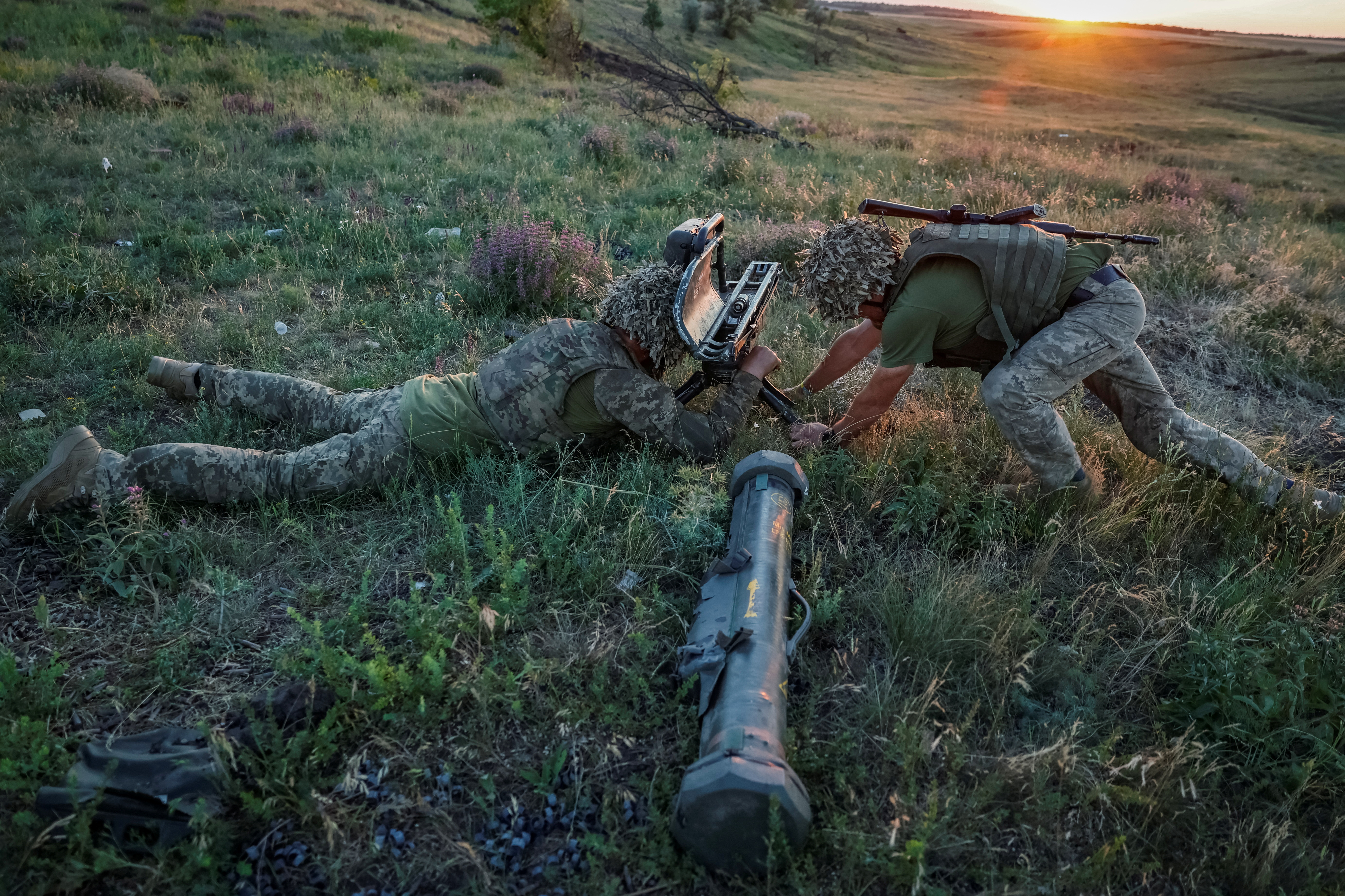 Ukrainian service members attend military drills near a frontline in Donetsk region