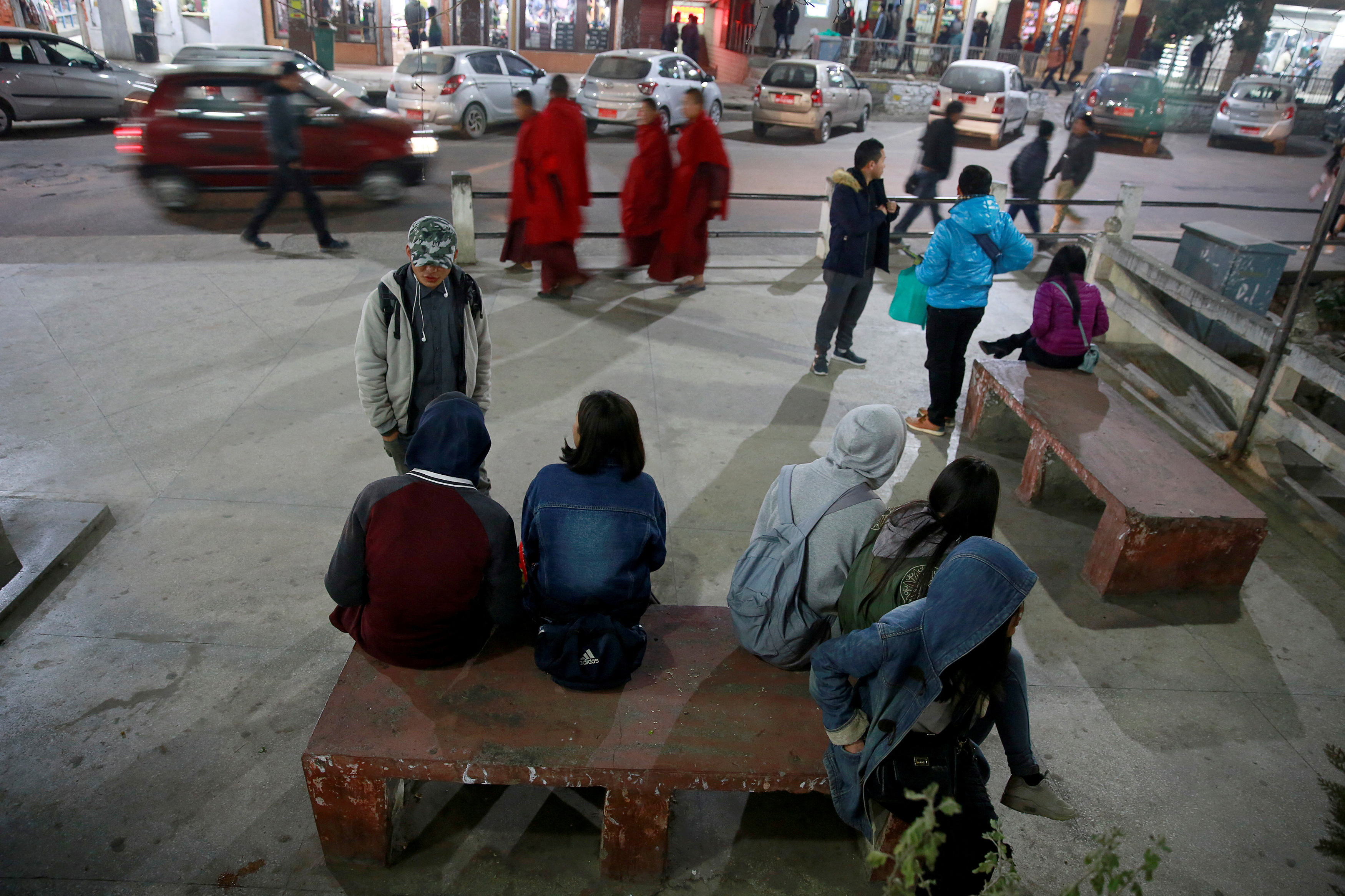FILE PHOTO: Youths gather in the centre of the capital city of Thimphu, Bhutan