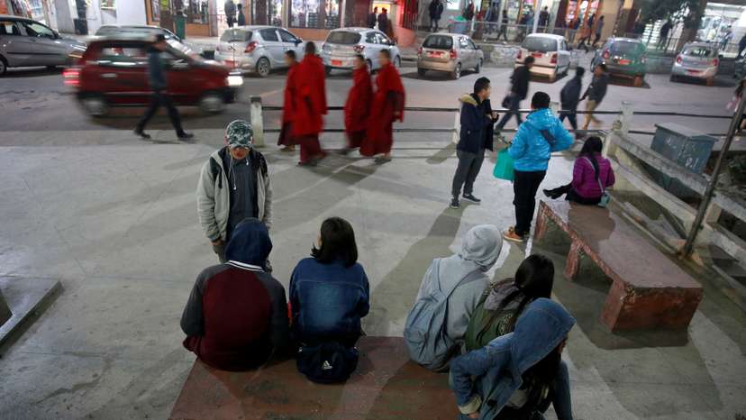 FILE PHOTO: Youths gather in the centre of the capital city of Thimphu, Bhutan