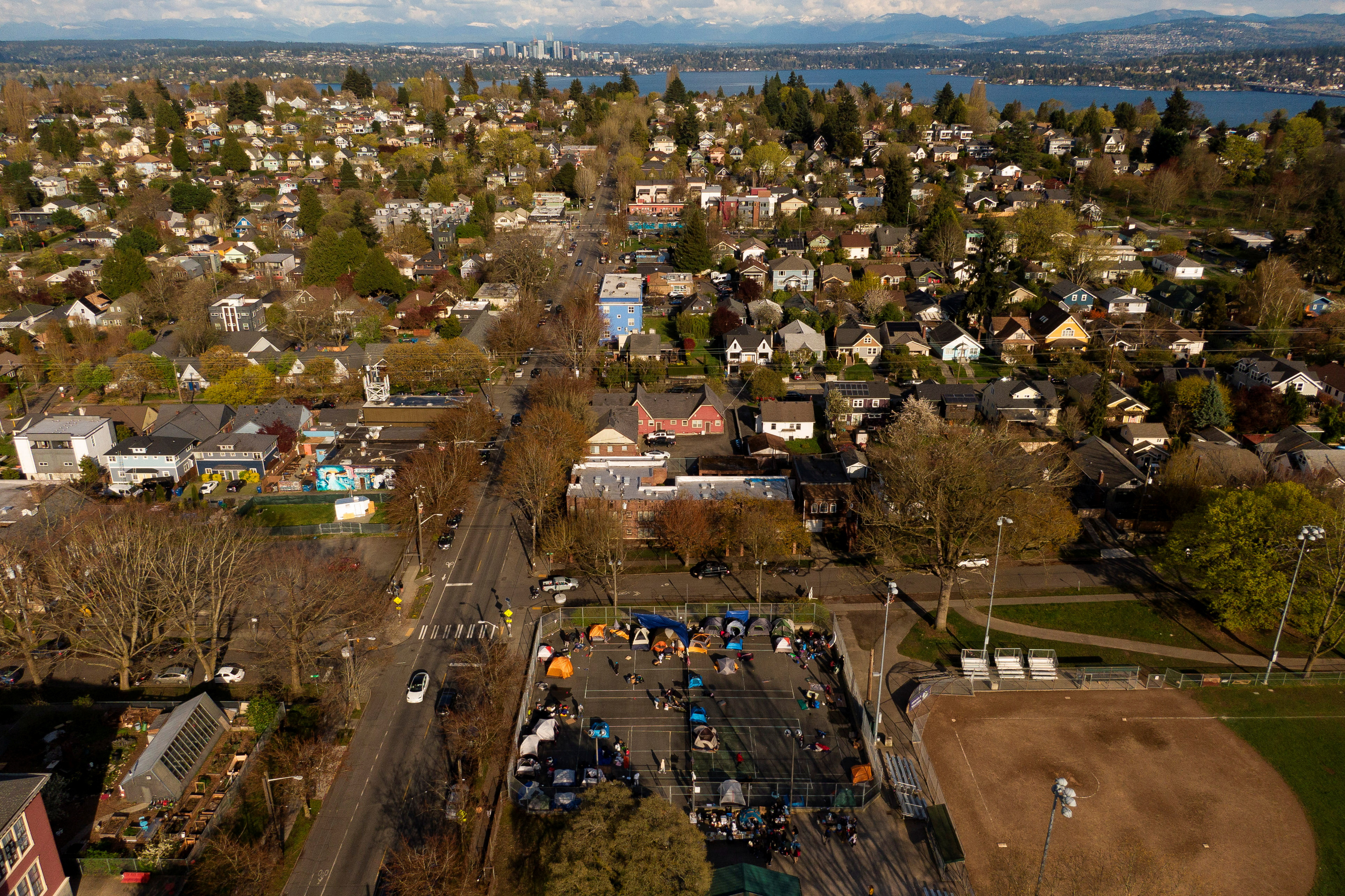 Venezuelan migrants camp on the tennis courts of a community center in Seattle