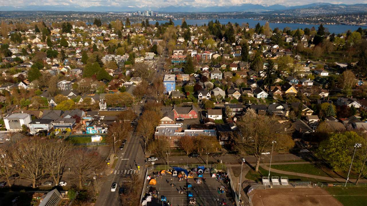 Venezuelan migrants camp on the tennis courts of a community center in Seattle