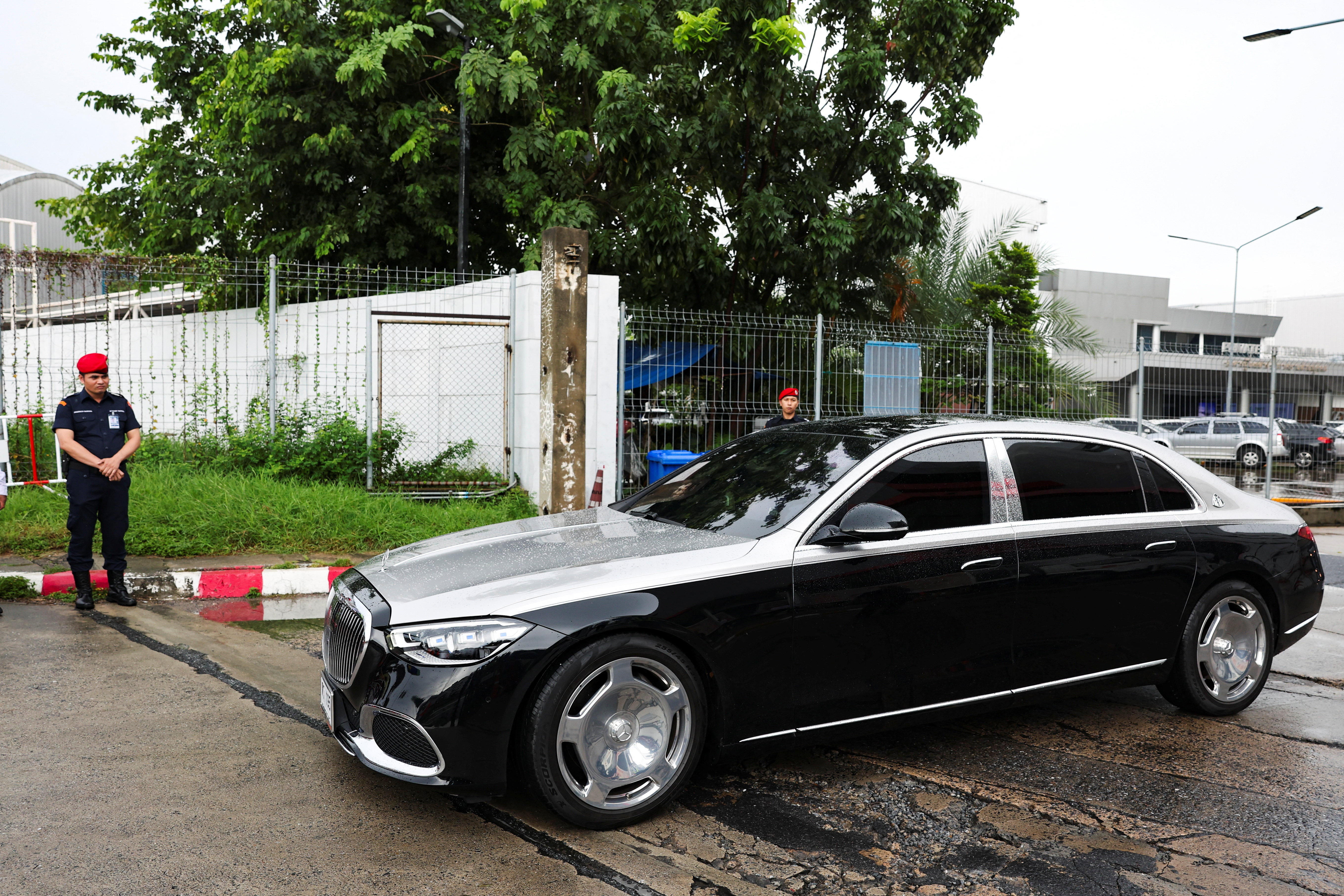 Motorcade believed to be carrying Thailand's former Prime Minister Thaksin Shinawatra drives by, in Bangkok