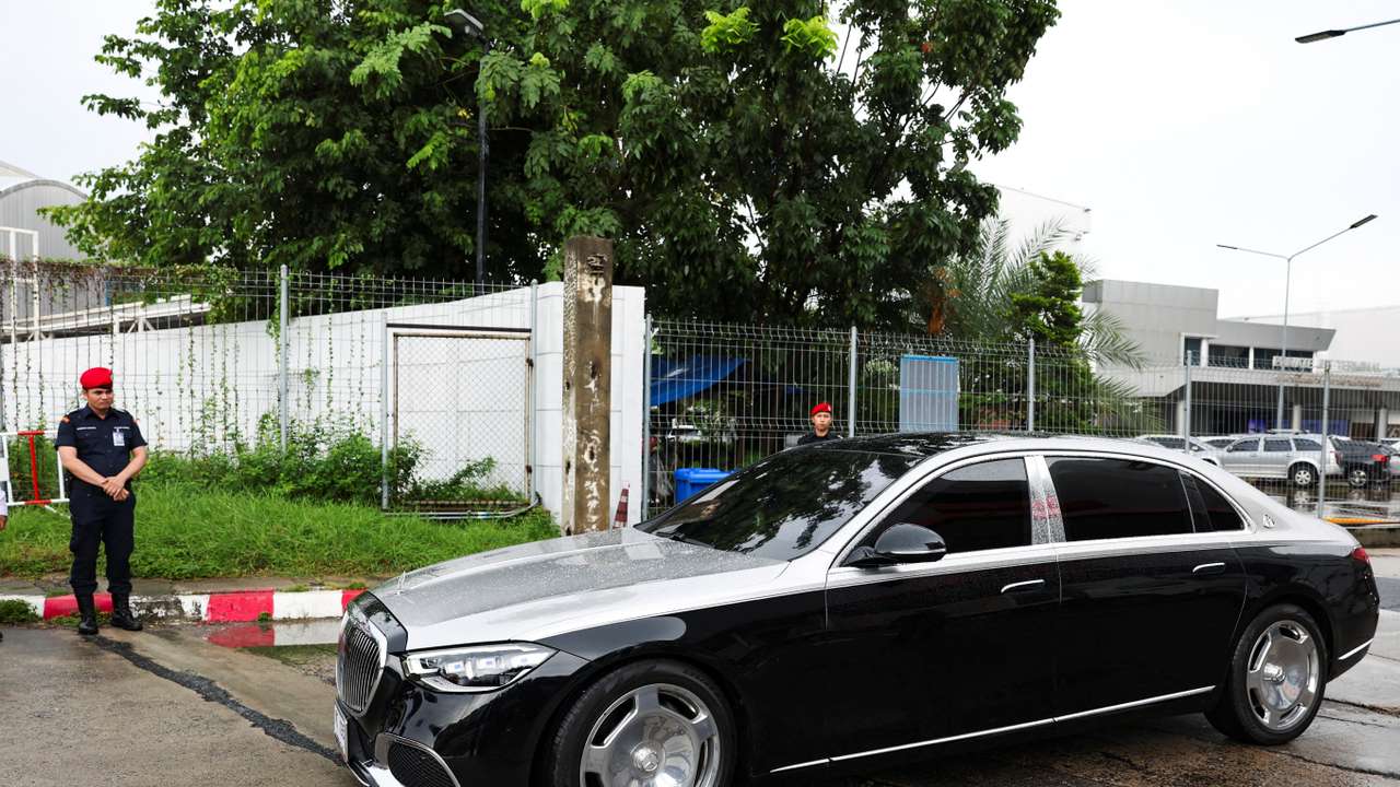 Motorcade believed to be carrying Thailand's former Prime Minister Thaksin Shinawatra drives by, in Bangkok