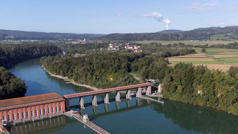 FILE PHOTO: Steam rises from nuclear power plant KKW Leibstadt behind the hydropower plant Eglisau in Rheinsfelden, Switzerland