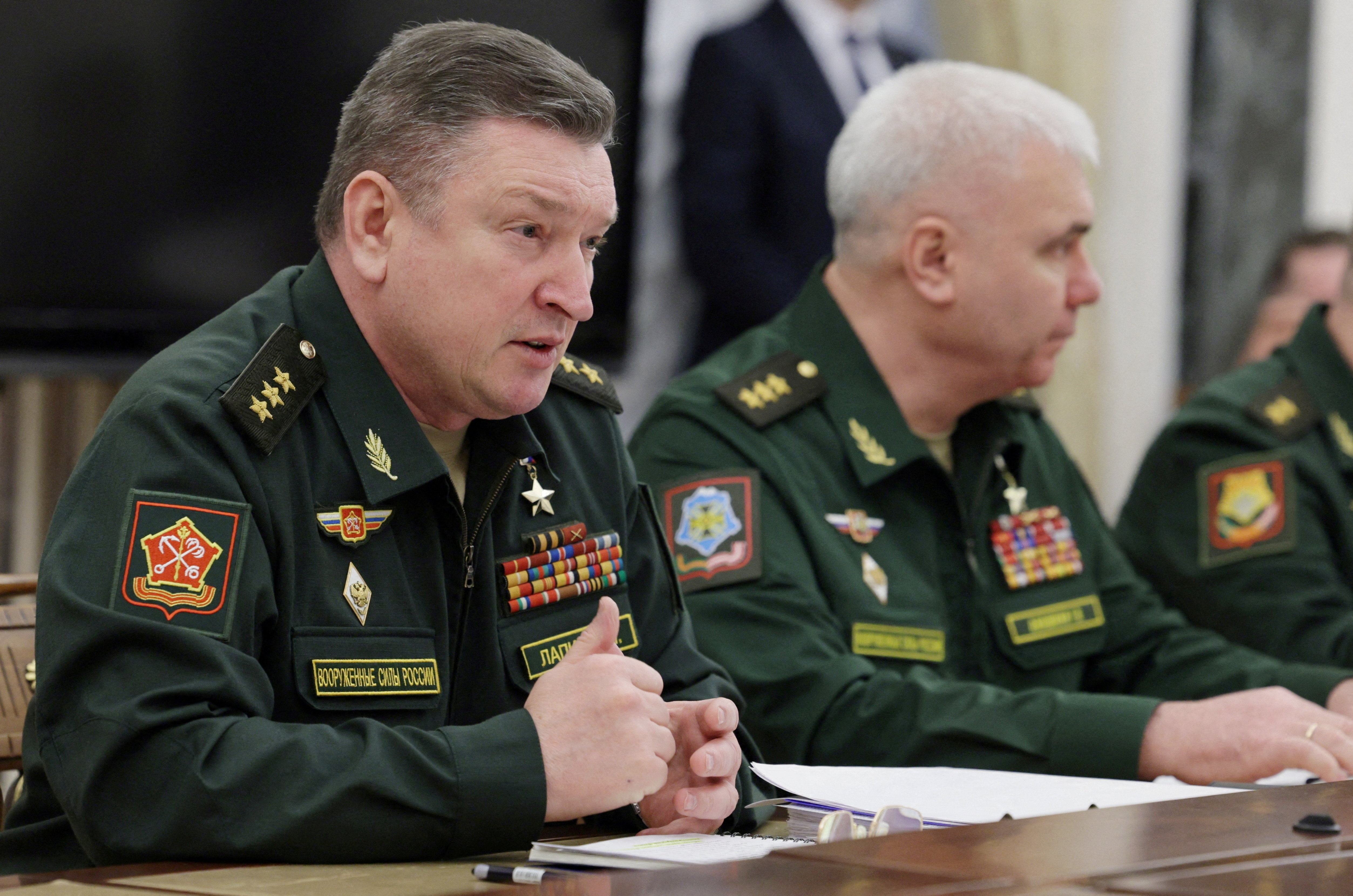 FILE PHOTO: Russian President Putin meets with commanders of troops of military districts, in Moscow