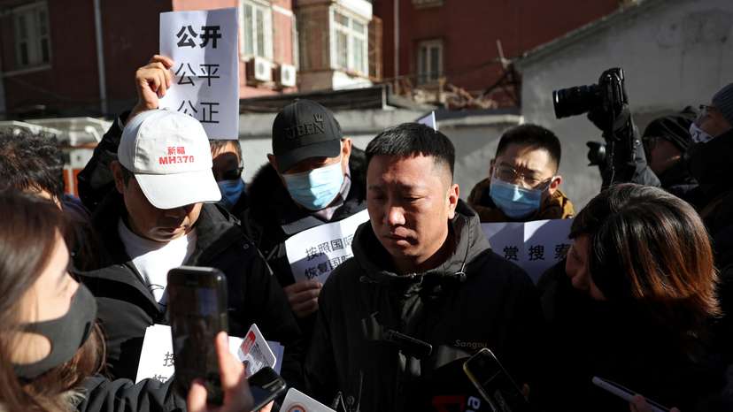 Family members of passengers on Malaysia Airlines flight MH370 that went missing in 2014, in Beijing