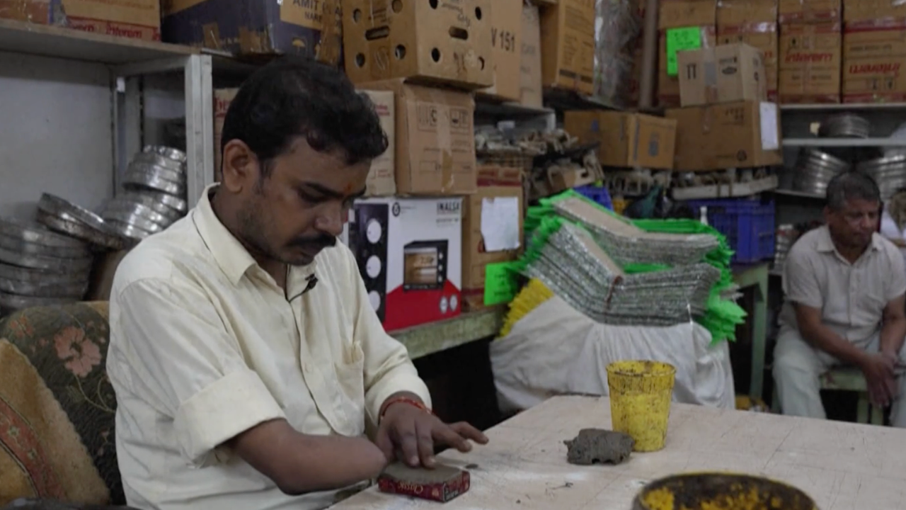 A disabled Indian artisan at work