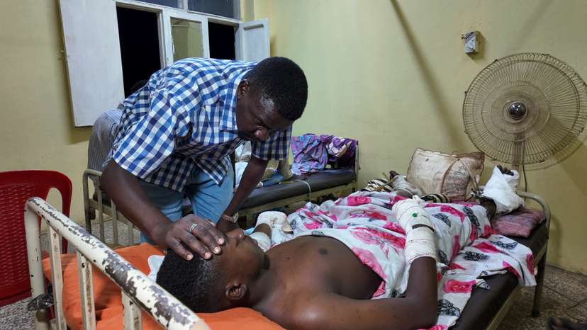A victim of unexploded ordnance lies on a bed at a hospital in Omdurman, as the Sudanese army deepens control in the city which is still largely held by the RSF