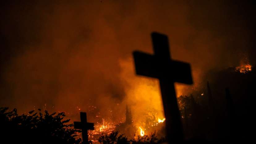 Wildifre burns in the village of Latas in southern Greece