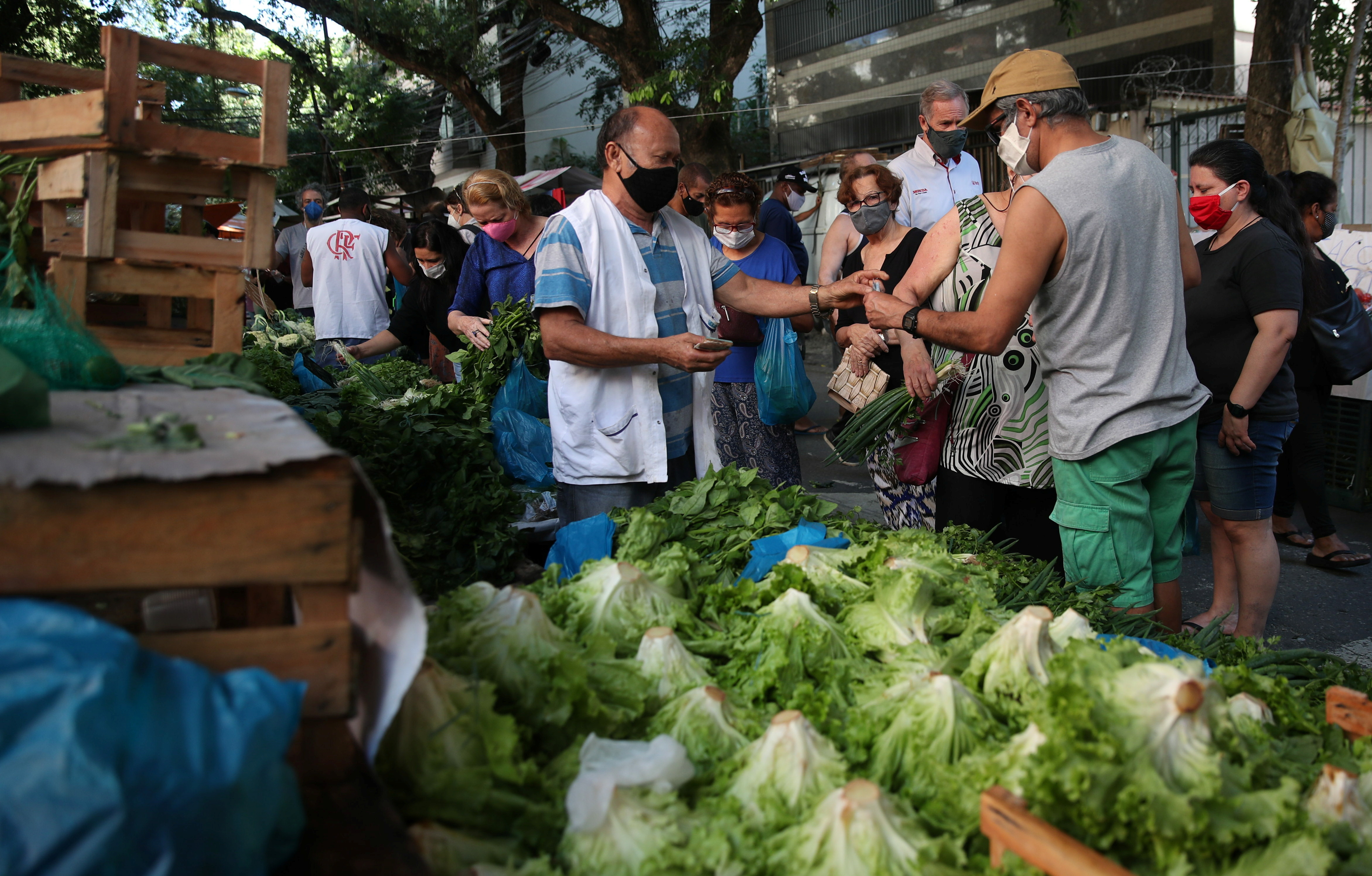 FILE PHOTO: Consumers shop at a weekly street market in Rio de Janeiro