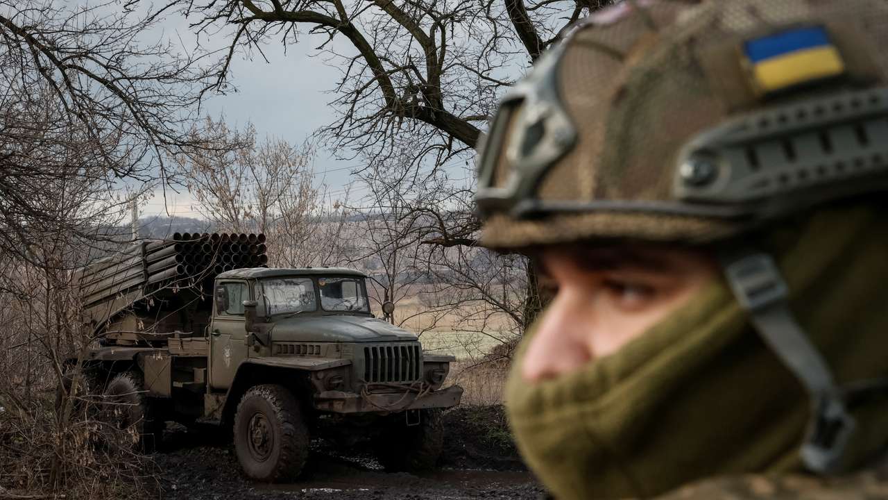 Ukrainian servicemen fire a BM-21 Grad multiple launch rocket system towards Russian troops in Donetsk region