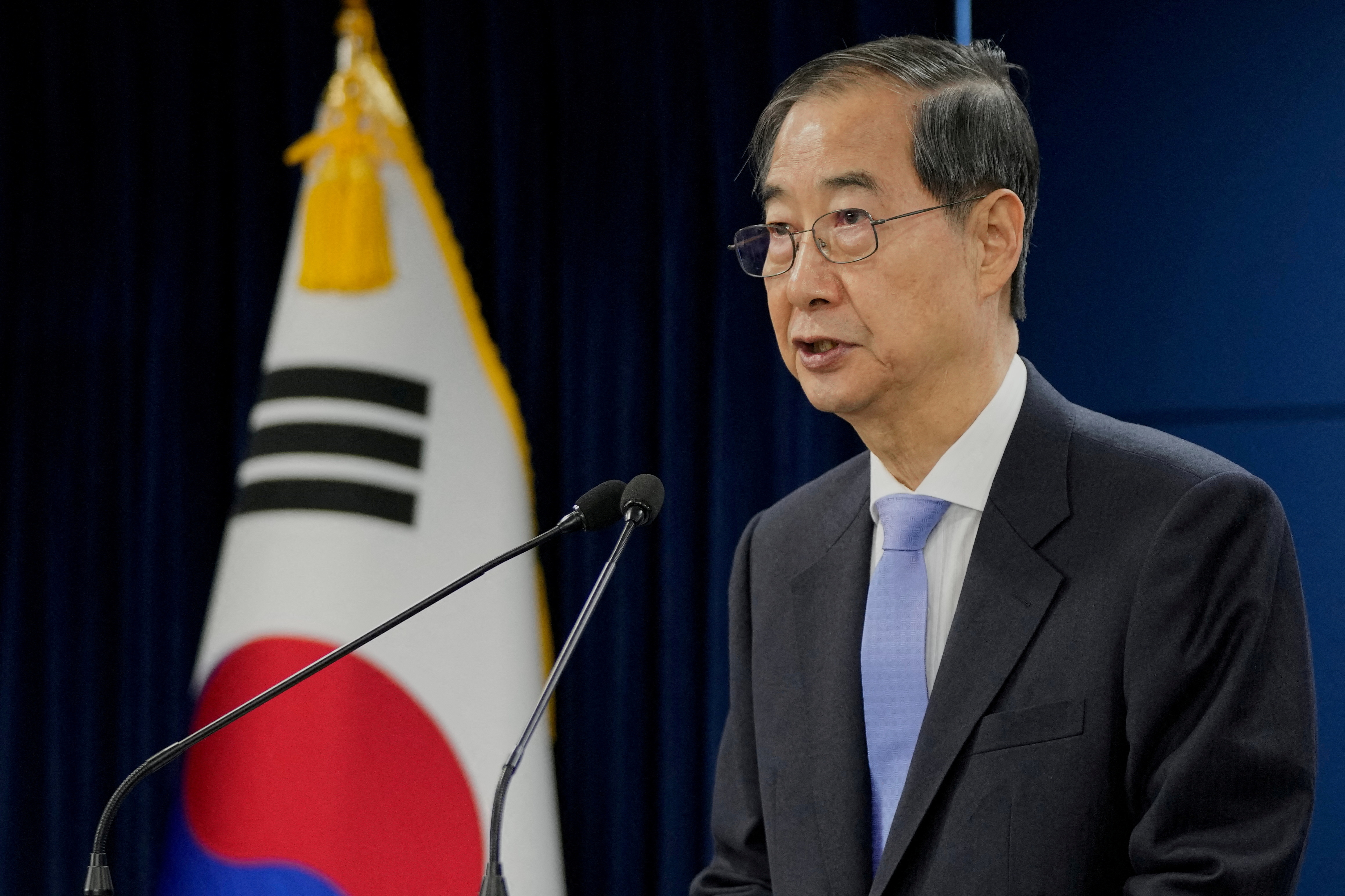 South Korean acting President Han Duck-soo speaks during a briefing at the Government Complex in Seoul