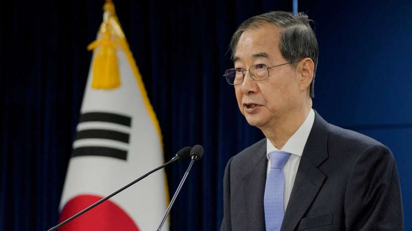 South Korean acting President Han Duck-soo speaks during a briefing at the Government Complex in Seoul