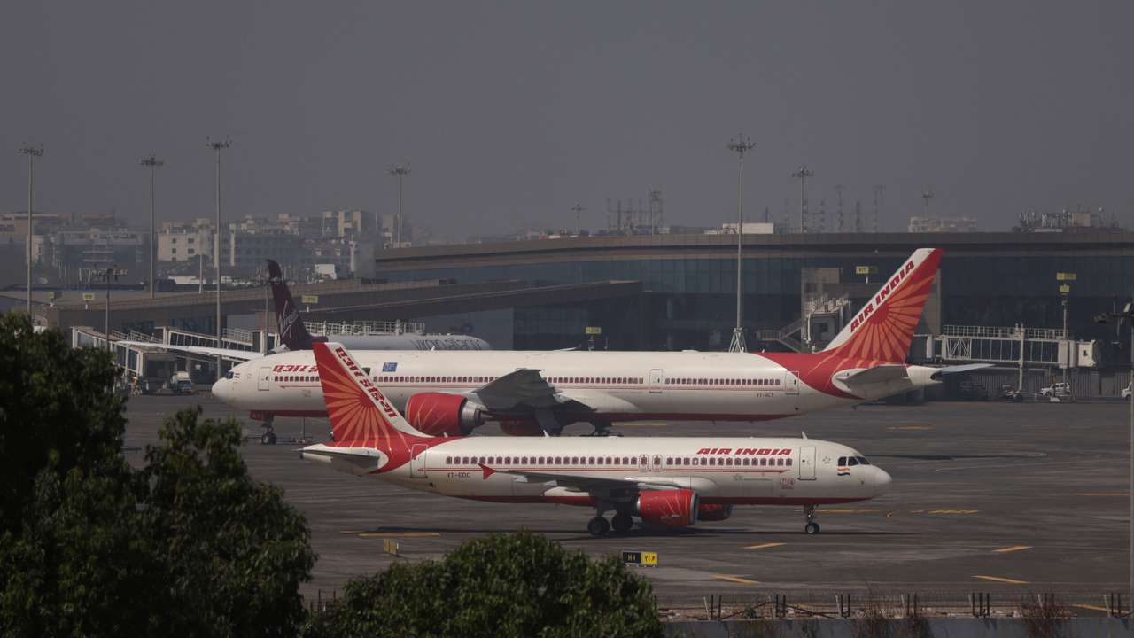Air India passenger aircraft are seen on the tarmac at Chhatrapati Shivaji International airport in Mumbai