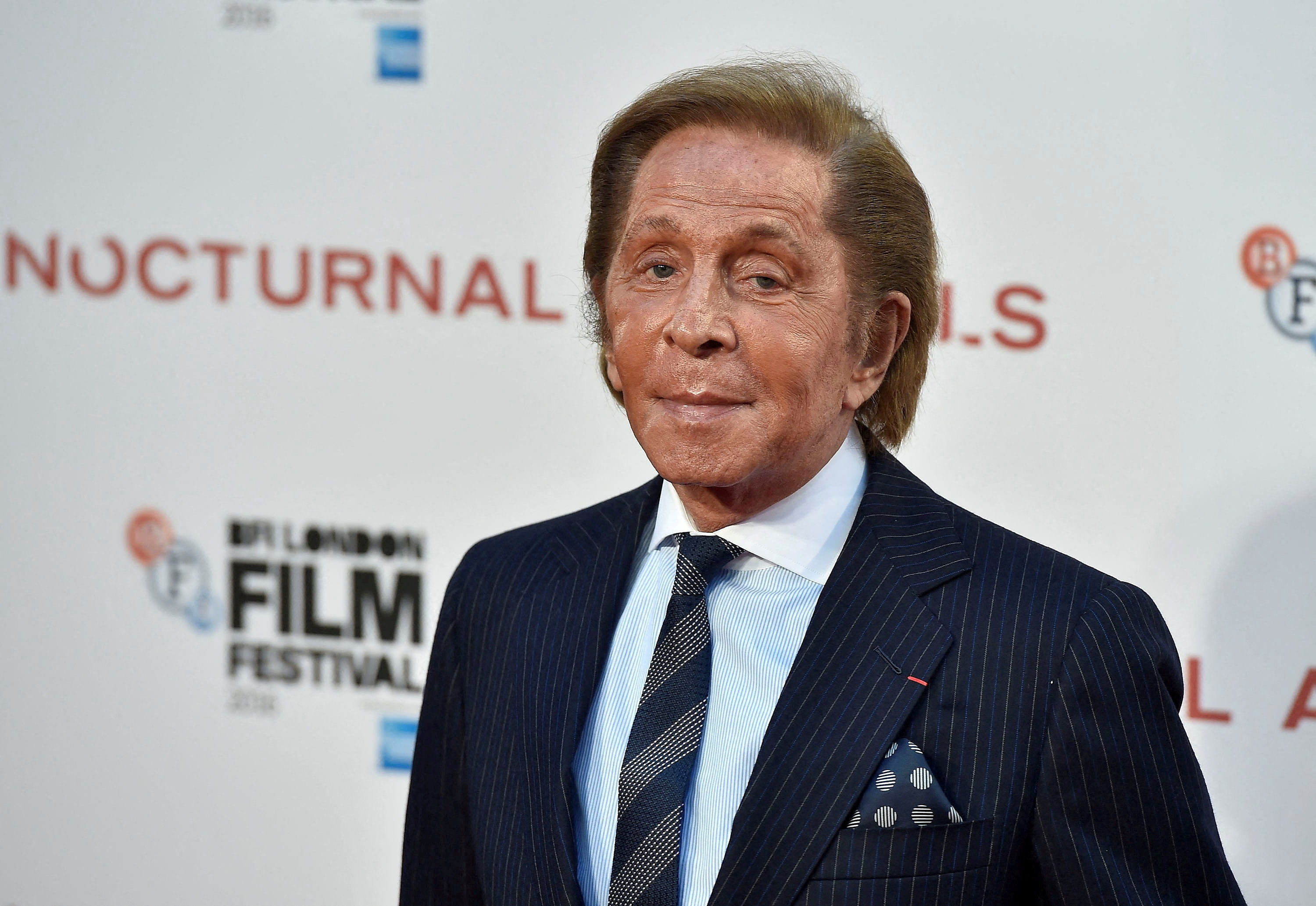 FILE PHOTO: Designer Valentino Garavani poses as he arrives for the gala screening of the film "Nocturnal Animals" during the 60th BFI London Film Festival at Leicester Square in London