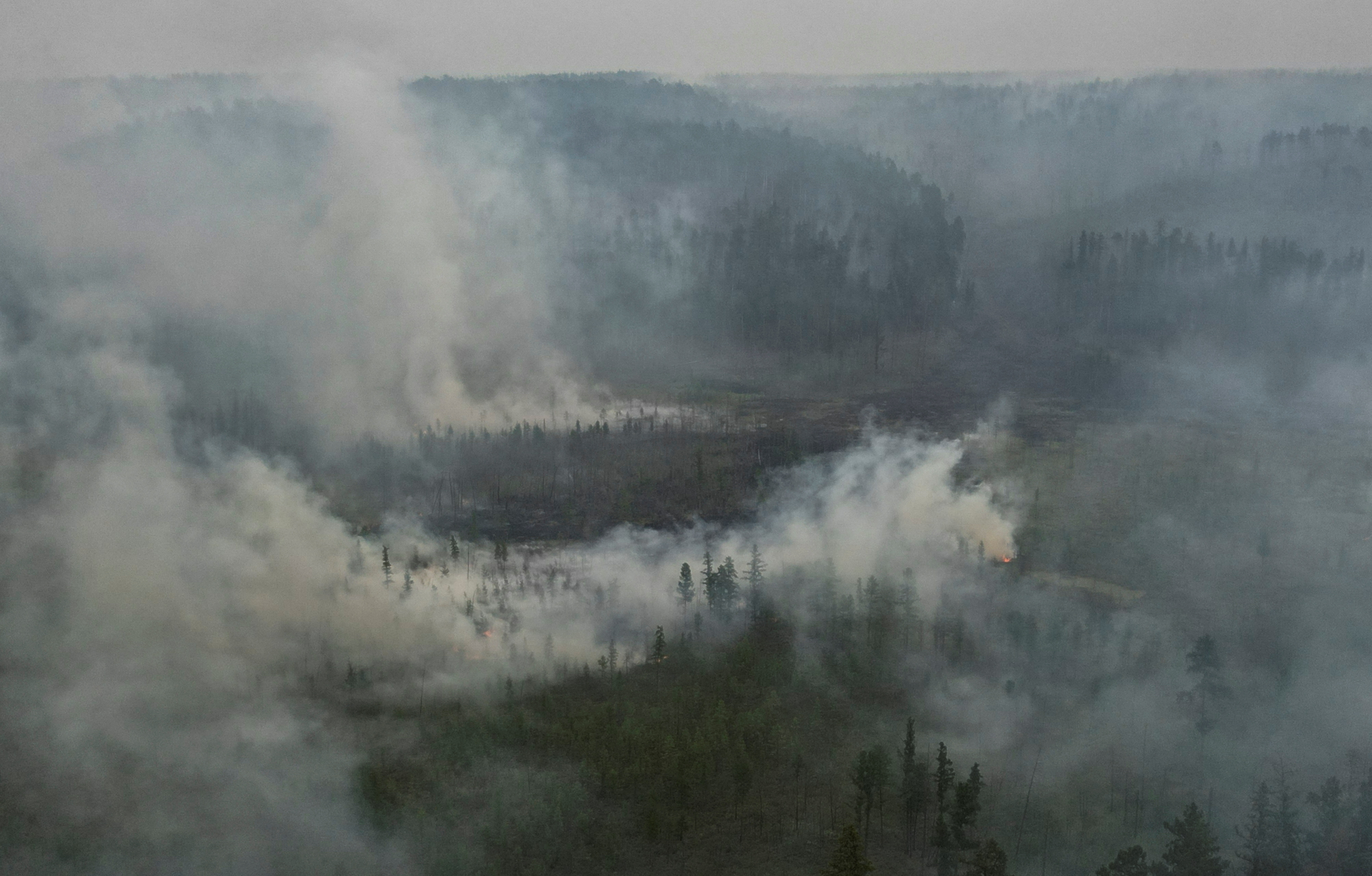 Firefighters in Russian Yakutia struggle to tackle wildfires amid latest hot summer