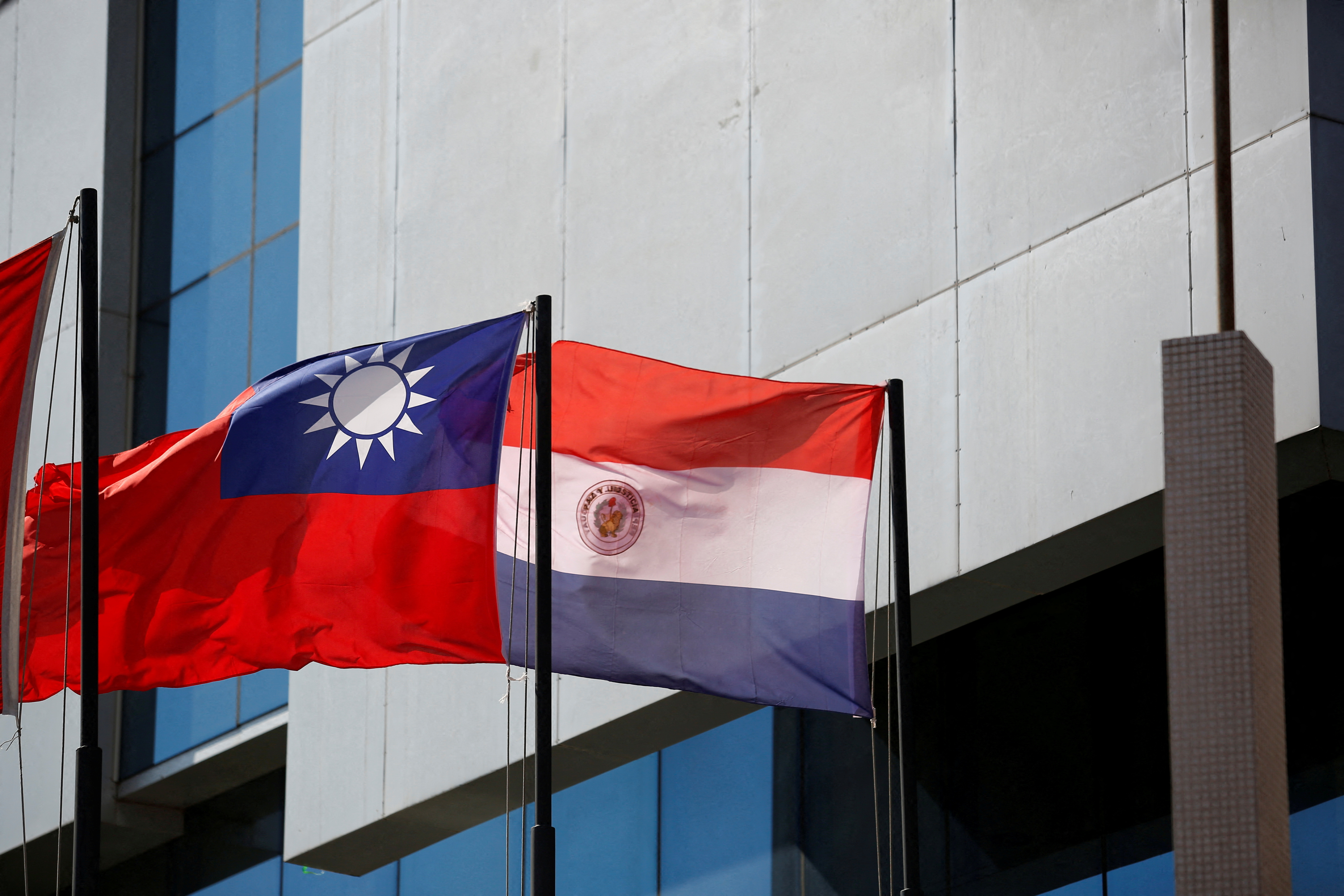 FILE PHOTO: The national flags of Paraguay and Taiwan are pictured outside the building housing Taiwan's embassy, in Asuncion