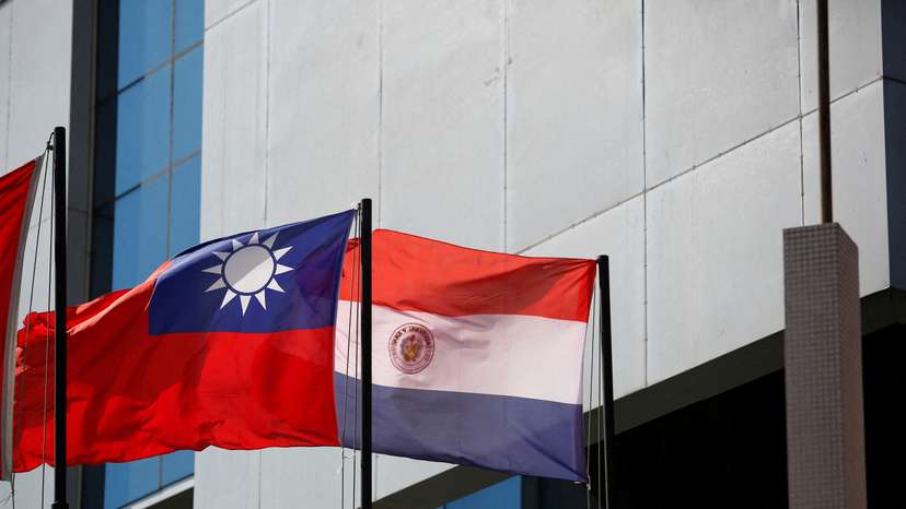 FILE PHOTO: The national flags of Paraguay and Taiwan are pictured outside the building housing Taiwan's embassy, in Asuncion