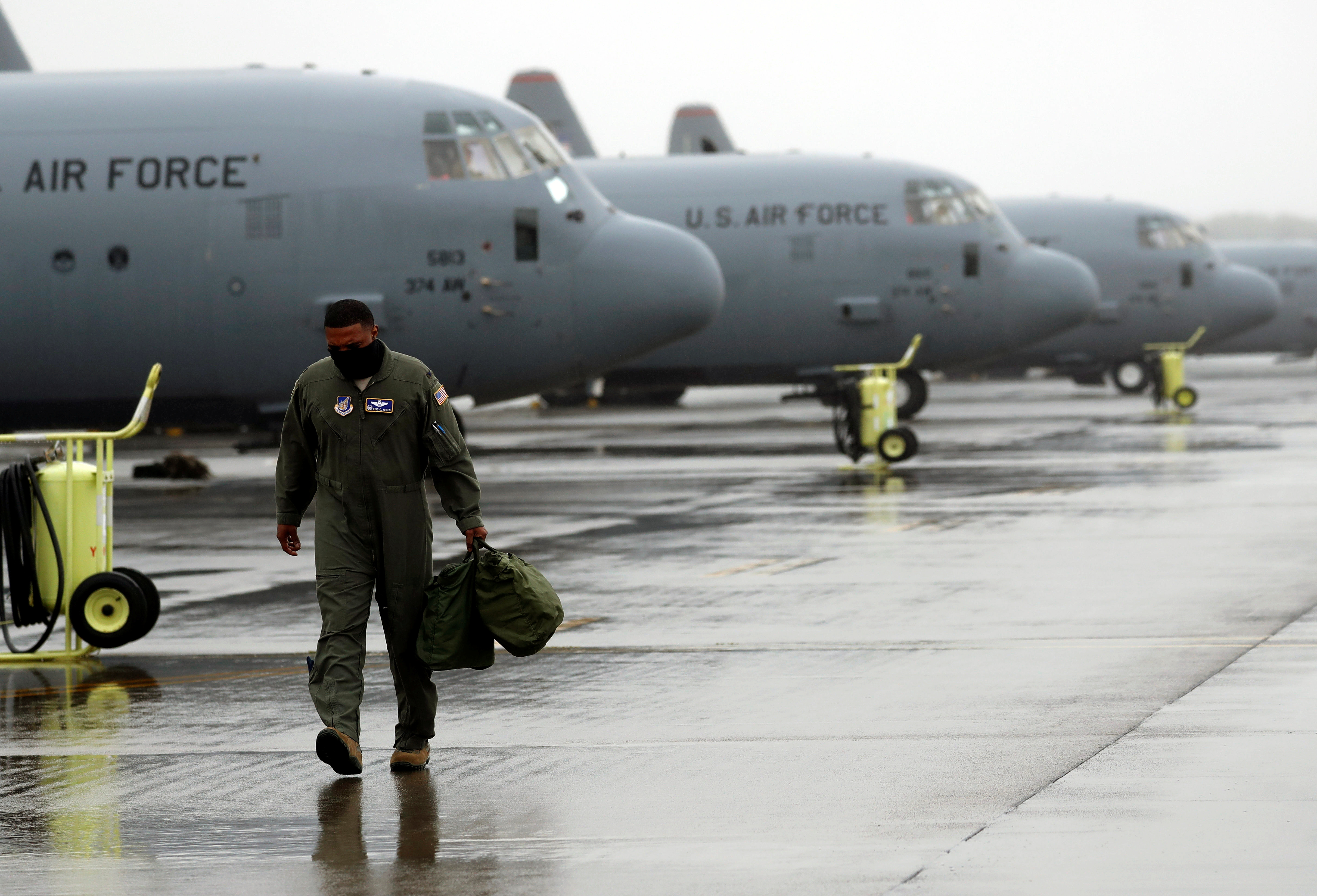 FILE PHOTO: A U.S. soldier is seen in front of C-130 transport planes at Yokota U.S. Air Force Base in Fussa