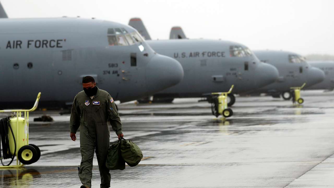 FILE PHOTO: A U.S. soldier is seen in front of C-130 transport planes at Yokota U.S. Air Force Base in Fussa