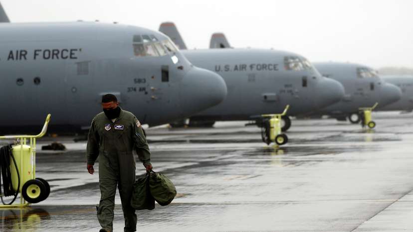 FILE PHOTO: A U.S. soldier is seen in front of C-130 transport planes at Yokota U.S. Air Force Base in Fussa