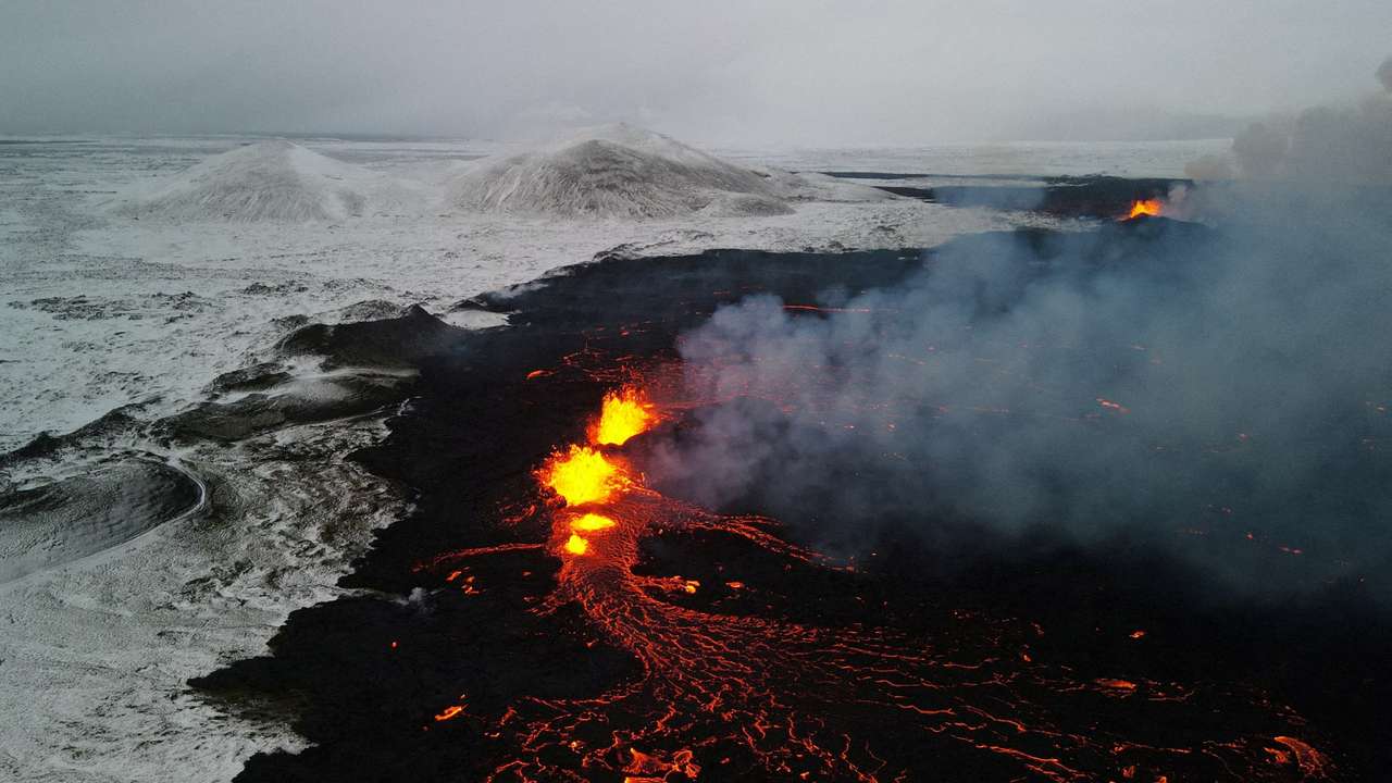 An aerial view of lava spewing from the site of the volcanic eruption north of Grindavik
