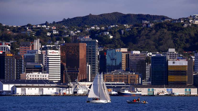 A sailing boat can be seen in front of the central business district of Wellington in New Zealand