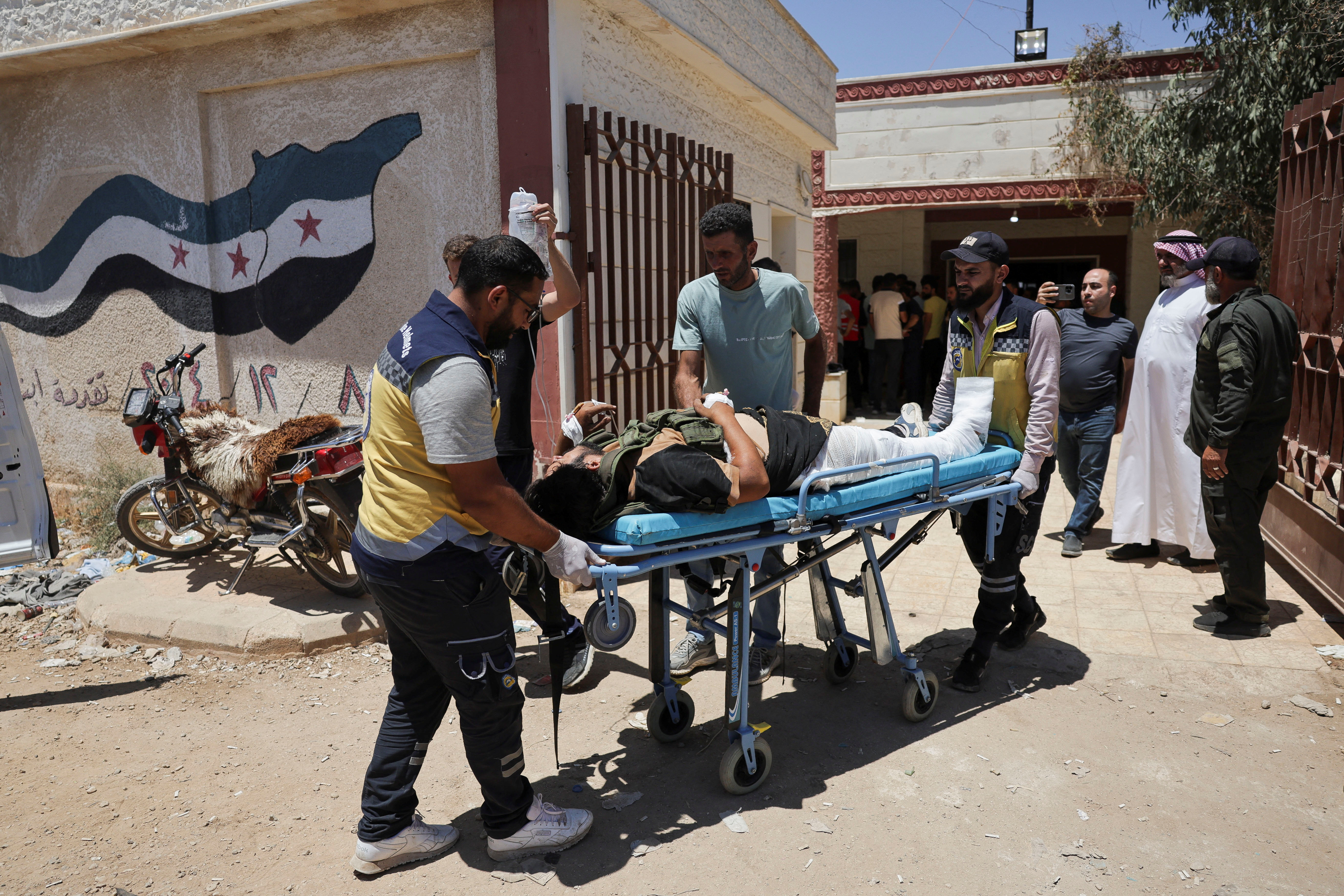 Casualties from recent clashes in Sweida receive treatment at a field medical point in Deraa