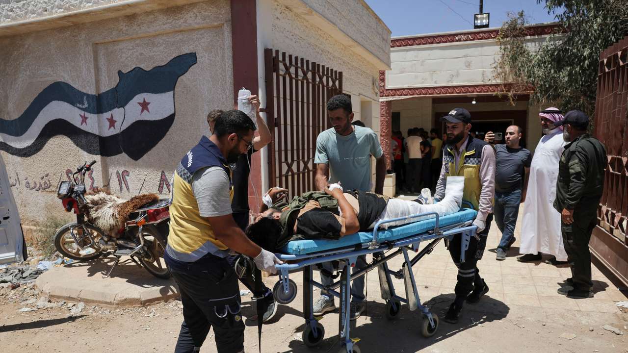 Casualties from recent clashes in Sweida receive treatment at a field medical point in Deraa