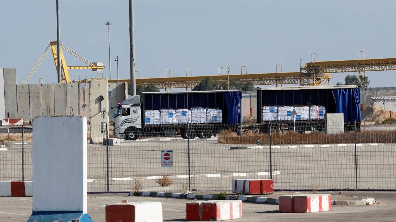 A truck carrying aid is parked at the Kerem Shalom crossing between Israel and Gaza, before going into Gaza, on the Israeli side of the Israel-Gaza border