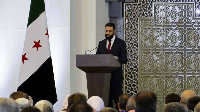 Syria's interim President Ahmed al-Sharaa speaks during a national dialogue, in Damascus