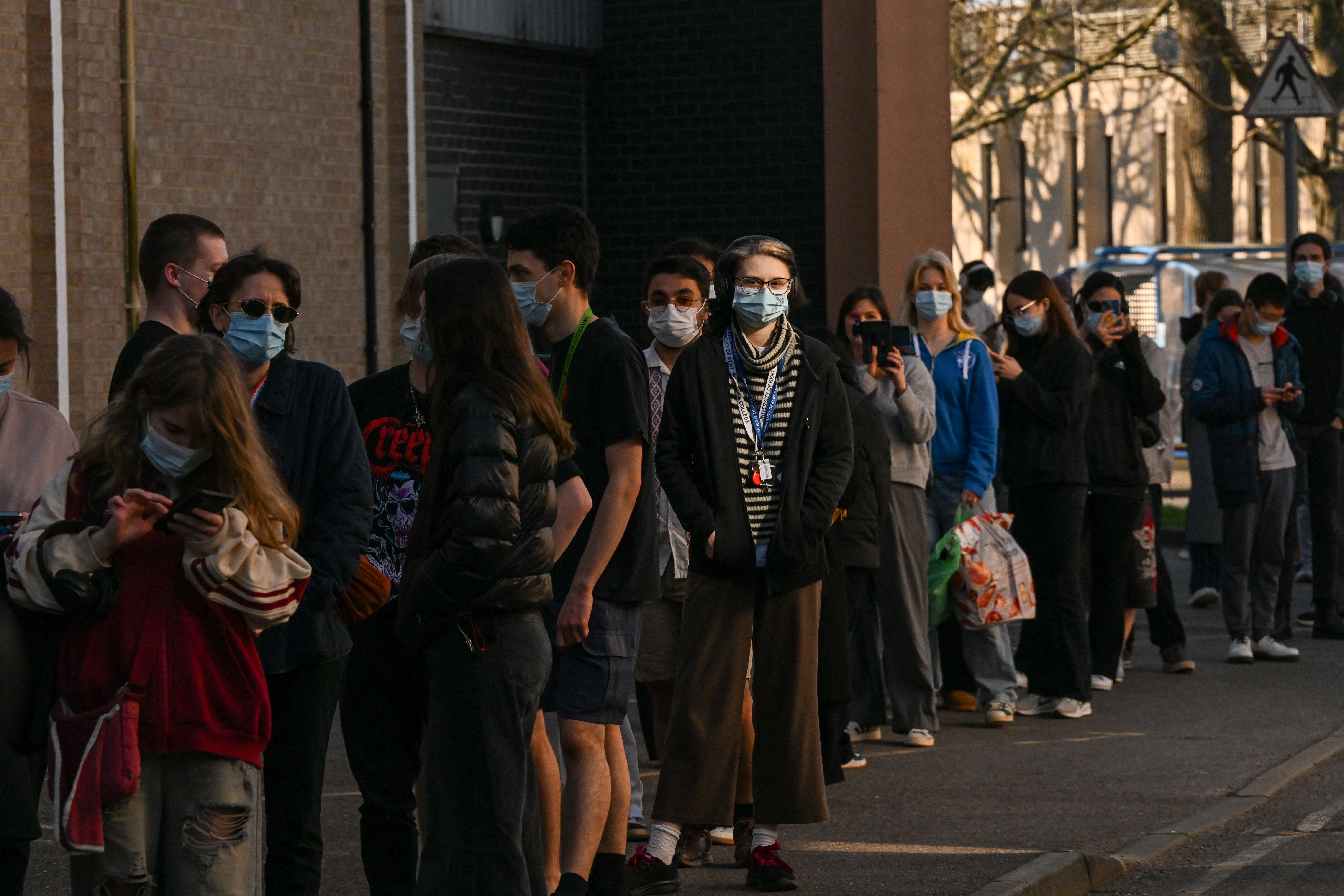 People queue to receive vaccinations at the Sports centre on the University of Kent campus, following an outbreak of meningitis cases in Kent