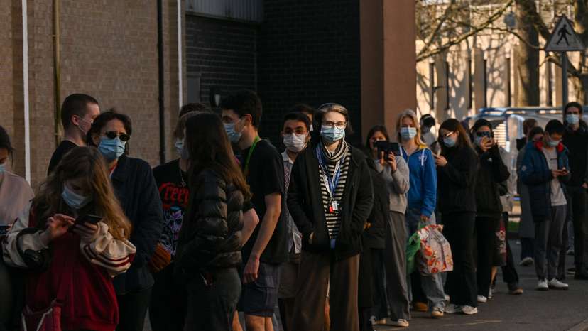 People queue to receive vaccinations at the Sports centre on the University of Kent campus, following an outbreak of meningitis cases in Kent