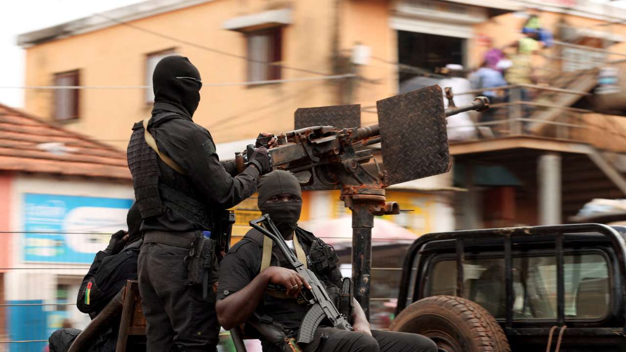 Soldiers patrol on the main road in Bissau