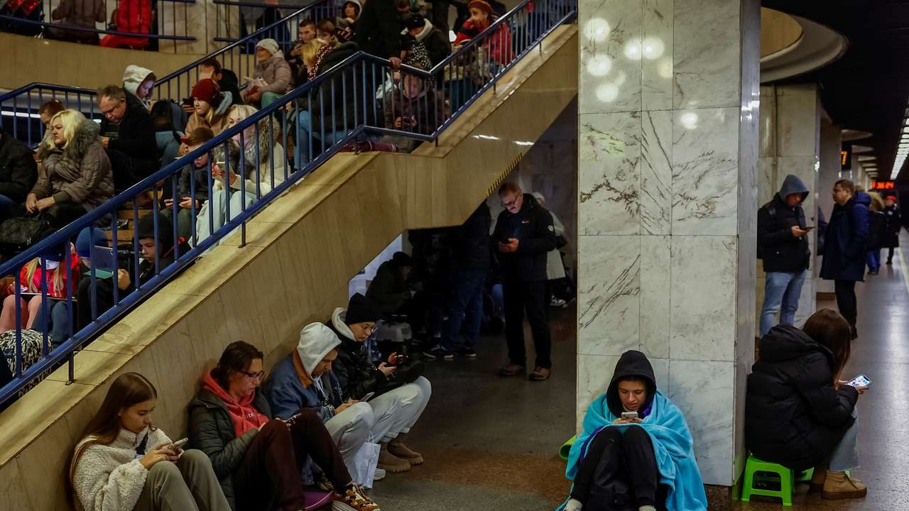 People take shelter inside a metro station during an air raid alert in Kyiv