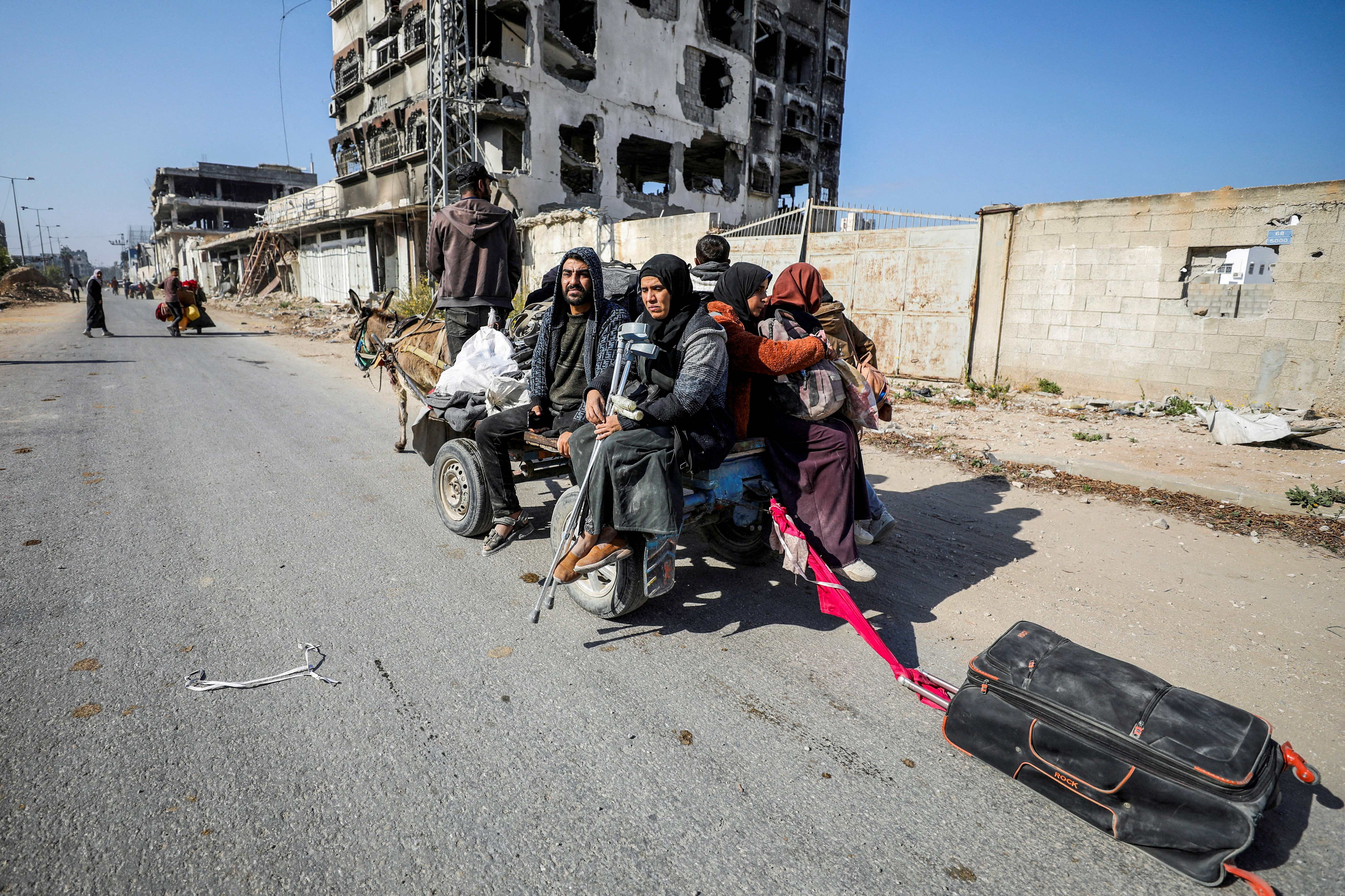 FILE PHOTO: Displaced Palestinians flee the northern part of Gaza amid an Israeli military operation, in Gaza City