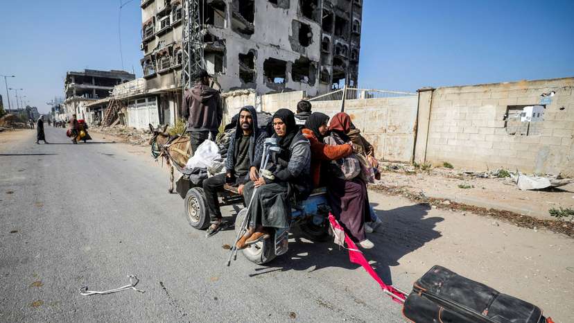FILE PHOTO: Displaced Palestinians flee the northern part of Gaza amid an Israeli military operation, in Gaza City