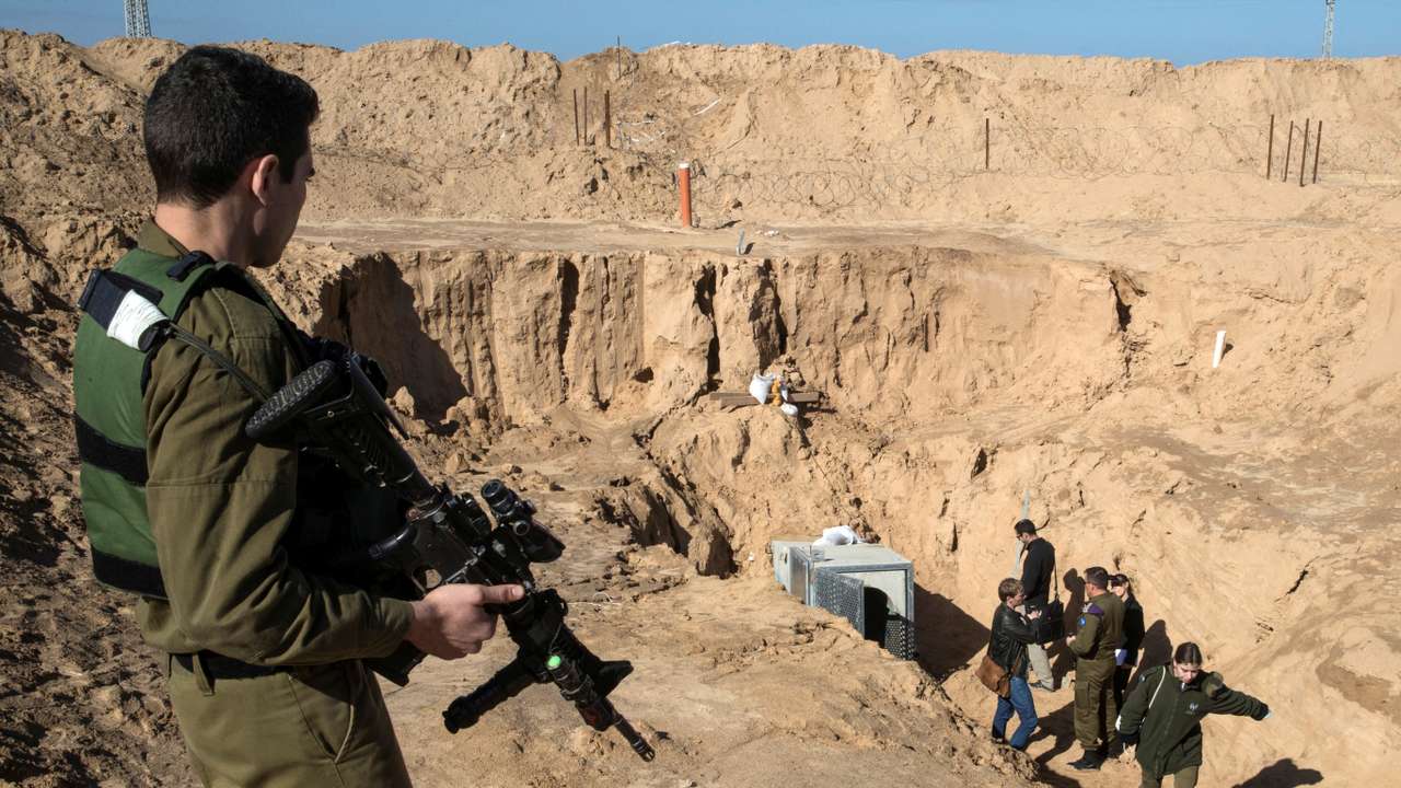 FILE PHOTO: An Israeli soldier keeps guard next to an entrance to what the Israeli military say is a cross-border attack tunnel dug from Gaza to Israel, on the Israeli side of the Gaza Strip border near Kissufim