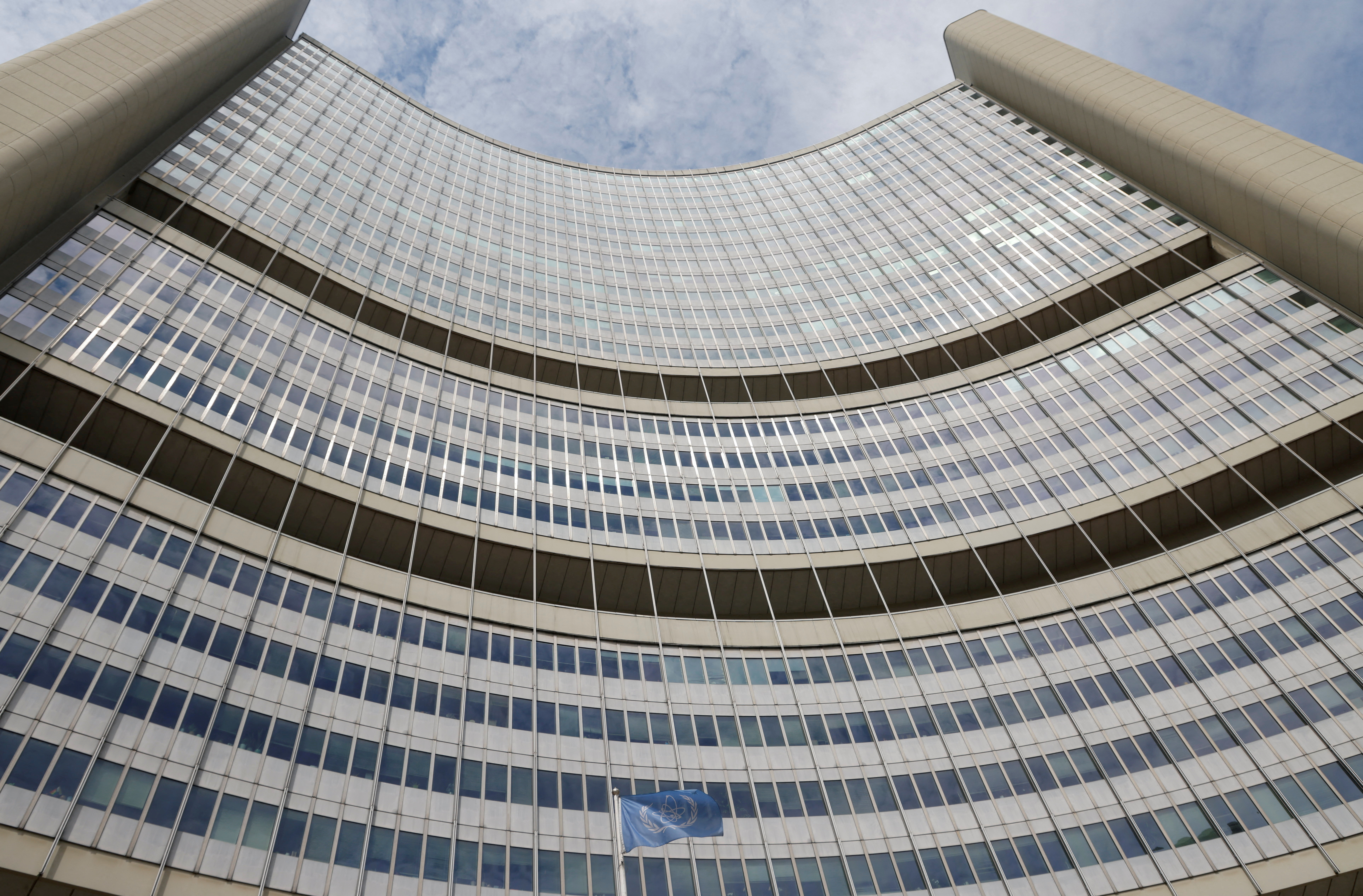 FILE PHOTO: IAEA flag flutters in front of its headquarters in Vienna