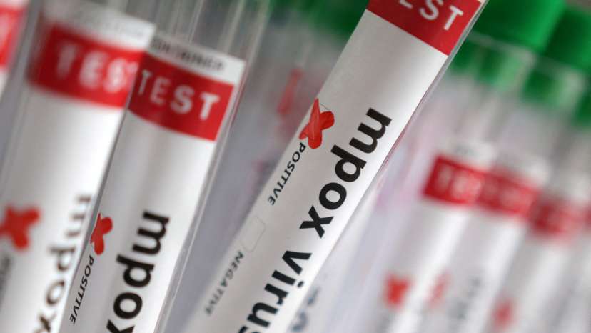 Illustration shows test tubes with "Mpox virus positive" label