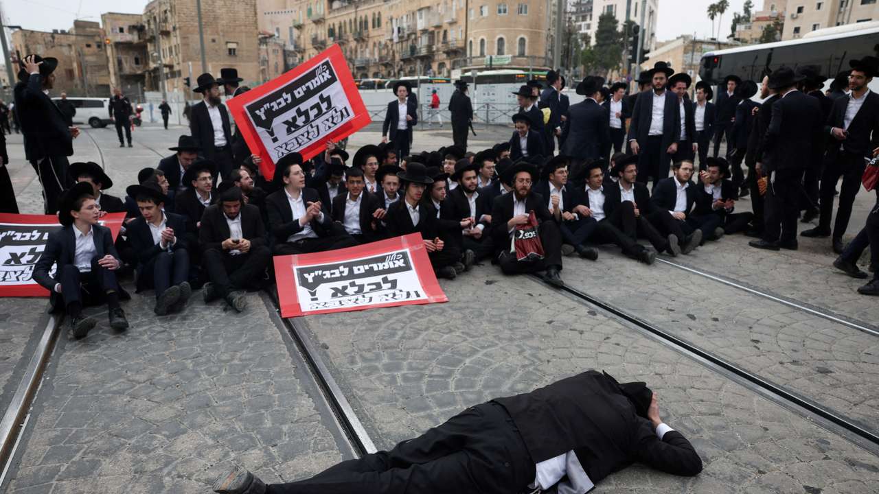 FILE PHOTO: Ultra-Ortodox Jewish men protest against attempts to change government policy that grants ultra-Orthodox Jews exemptions from military conscription, in Jerusalem