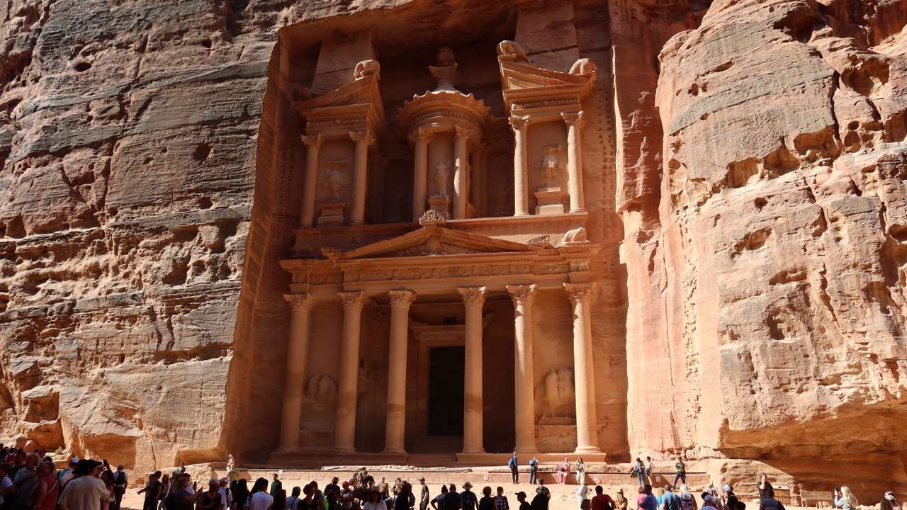 Visitors gather at the treasury site in the ancient city of Petra