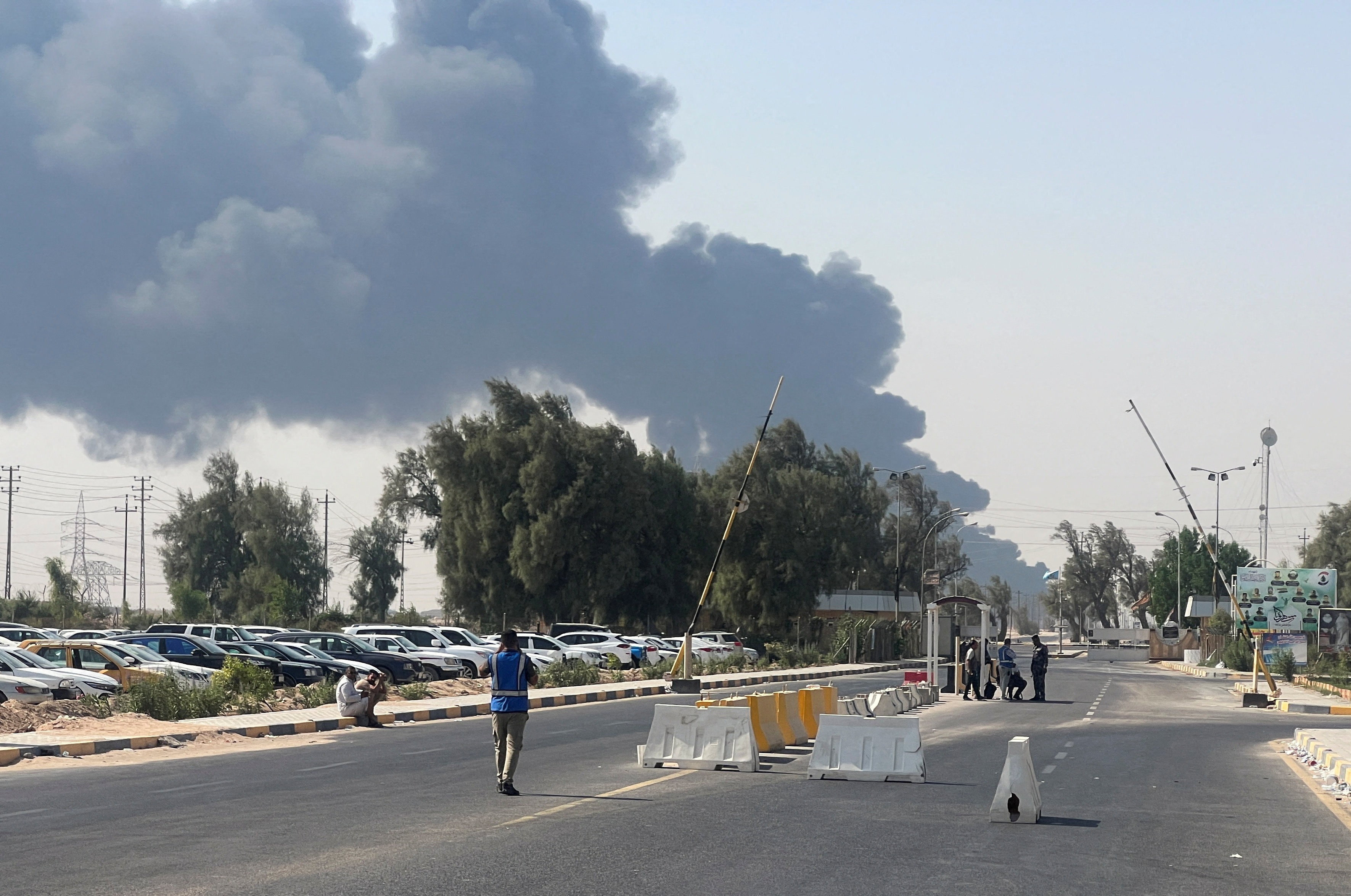 Smoke rises from a fire at an oil pipeline in Iraq's Zubair oilfield, near Basra