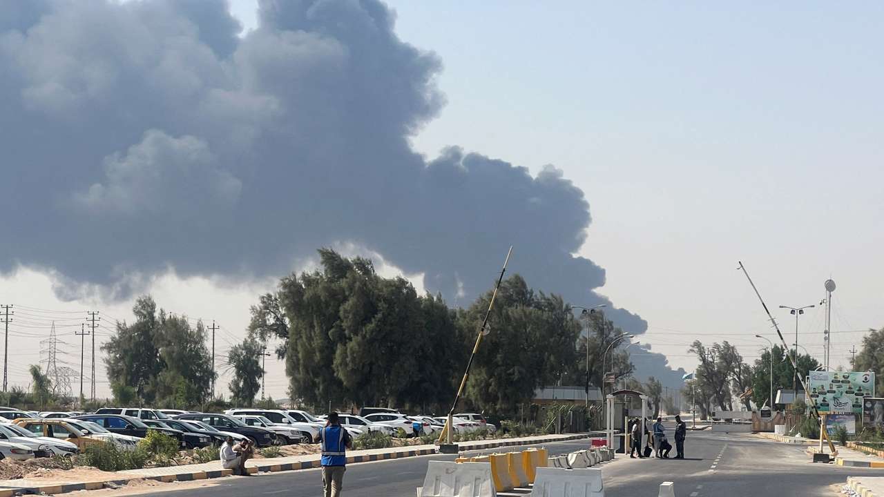 Smoke rises from a fire at an oil pipeline in Iraq's Zubair oilfield, near Basra