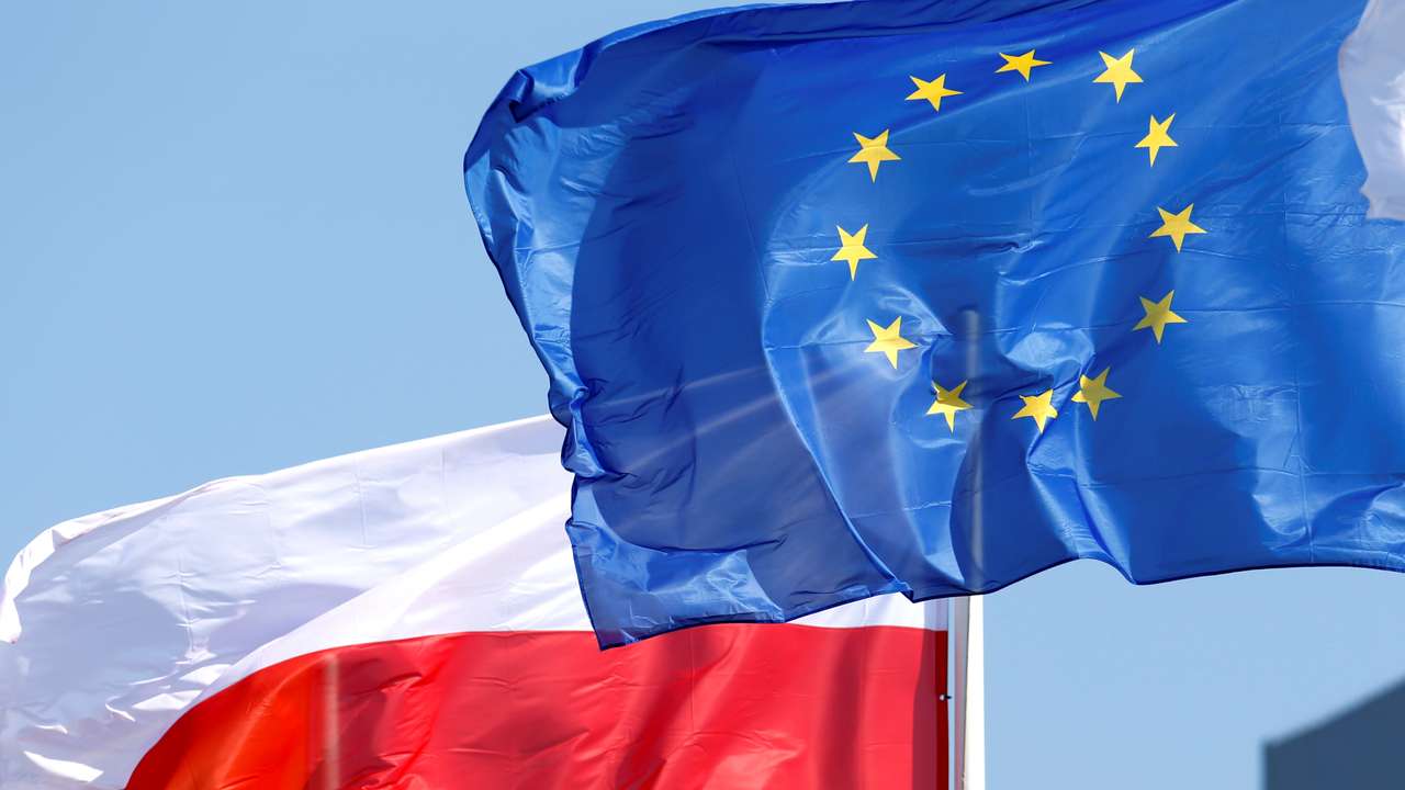 EU and Poland's flags flutter at the Orlen refinery in Mazeikiai