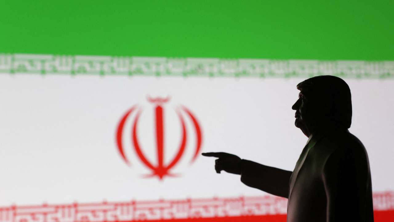 A 3D-printed miniature model depicting U.S. President Donald Trump and Iran flag in this illustration taken, April 17, 2025. REUTERS/Dado Ruvic/Illustration